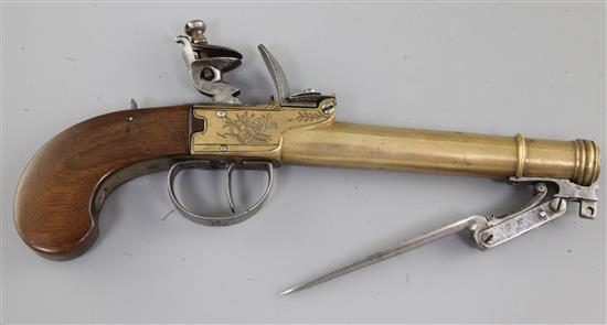 A Belgian brass framed and brass cannon barrelled flintlock boxlock overcoat pistol, 10.5in (14.5in with bayonet)